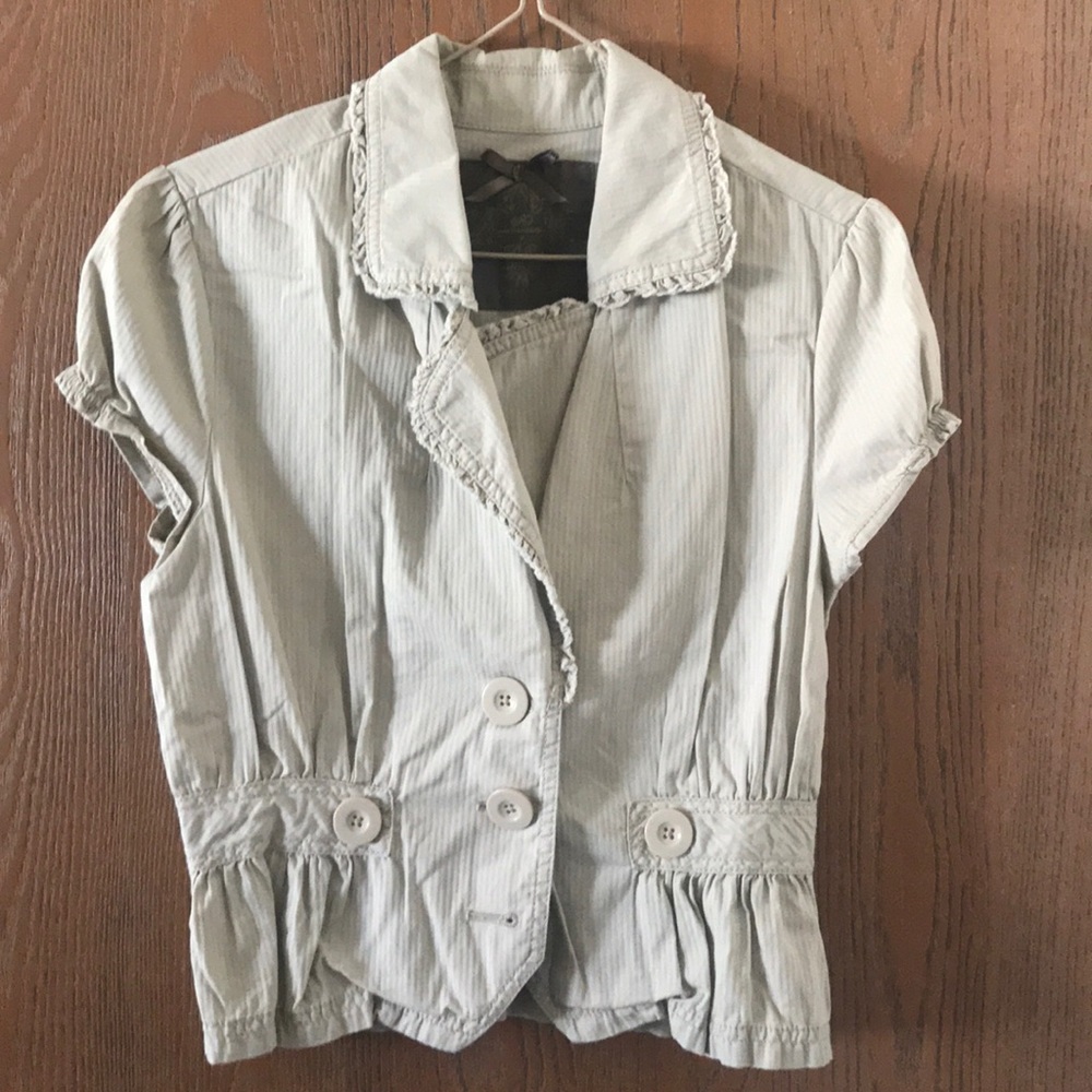 Tan cropped jacket.